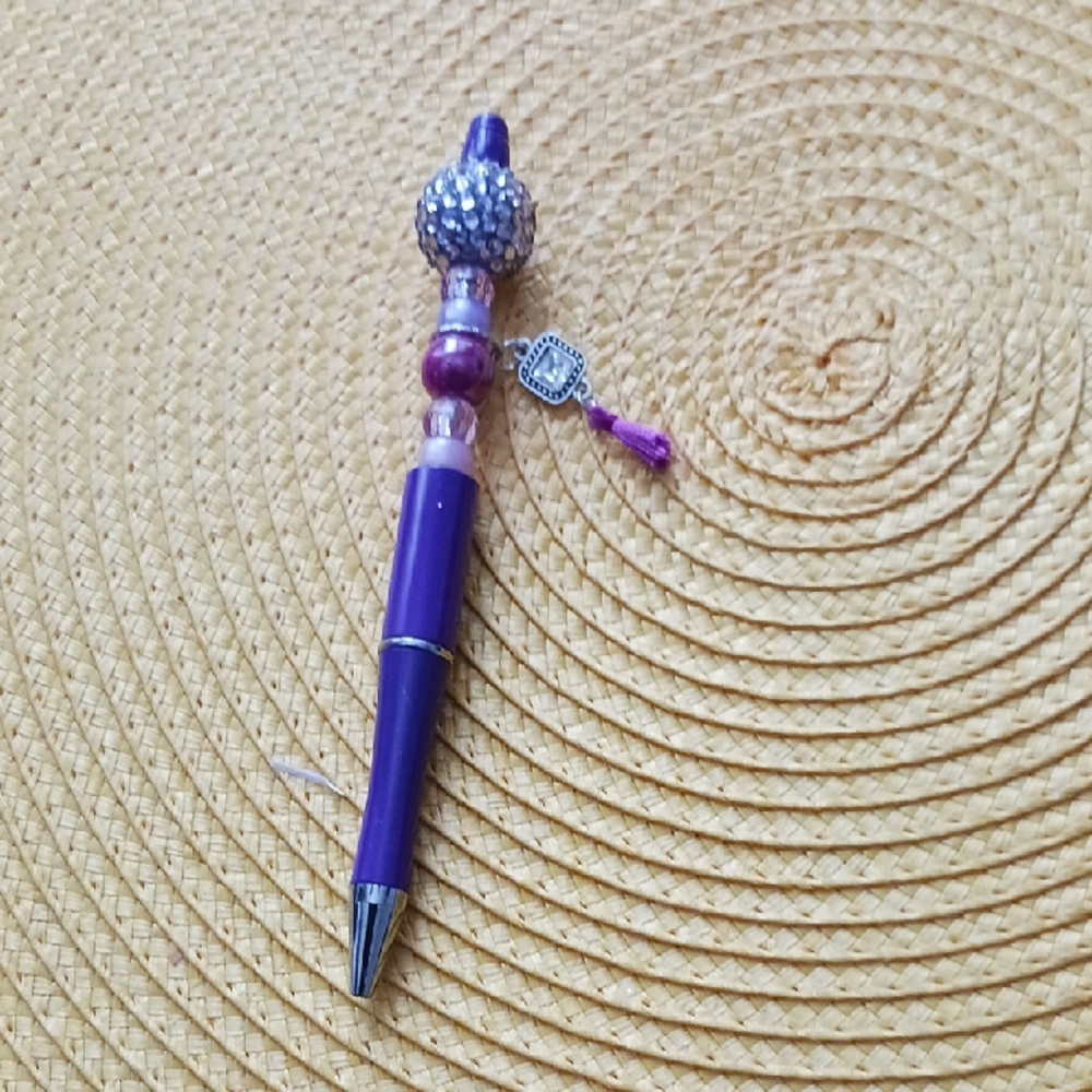 Purple Beaded Pen with Silver Accents. Black Ink